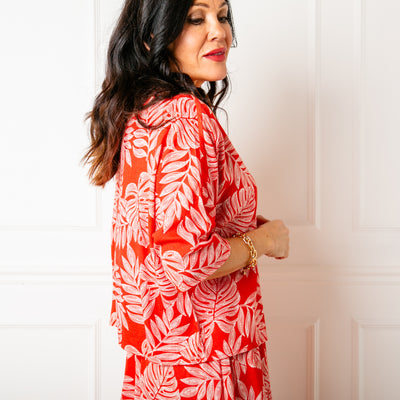 The red Linen Leaf Button Down Top with 3/4/ length sleeves that end around the elbow